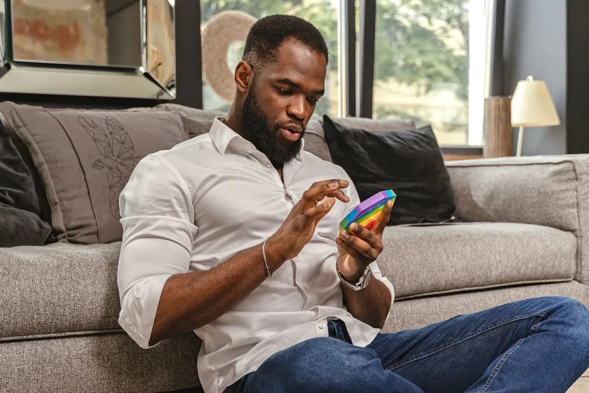 A person using a sensory fidget at home.